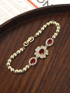 Gold Bracelet with Red Crystal Flower Center